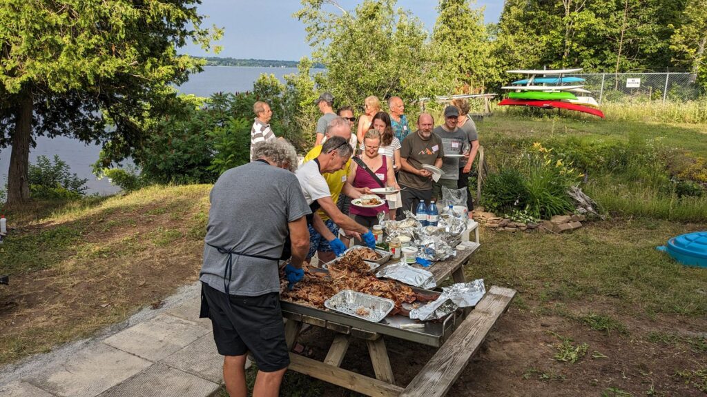 Members lining up for food during sailpast 2024